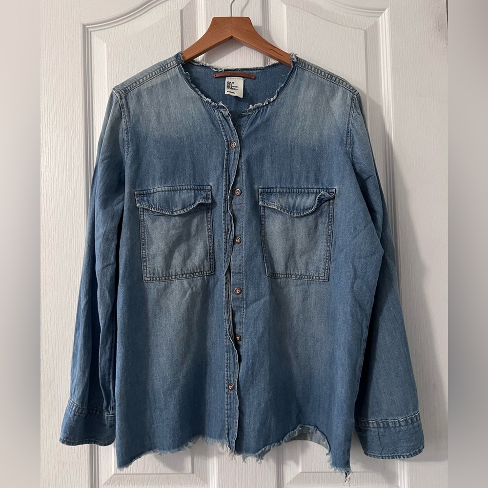 Denim long sleeve top with intentional distressing. Raw hem at bottom & neck. 8